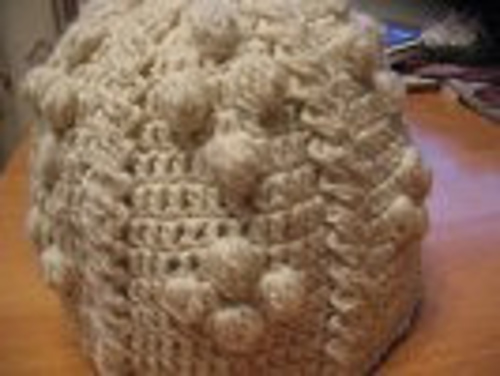 Heegeldatud palmikutega müts