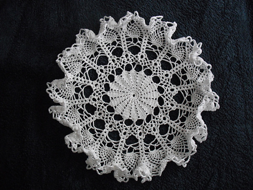 White doily with frills