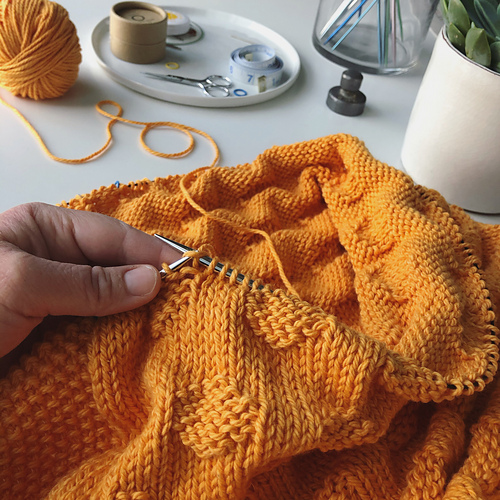 Knit in one piece on long circular needles.