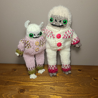 Yeti! Smaller outfit is made with US 2 needles and sport yarn, larger is dk yarn and US 2 needles 