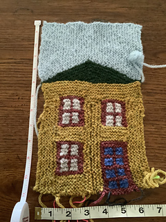 6/2: First house 5.10, completed. Oops! I forgot the window sill above the door. I might duplicate stitch it later.