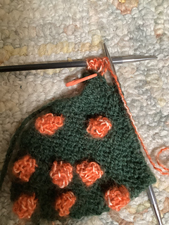 Last three stitches on holder while making bobble