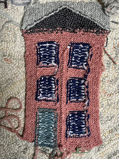 Wrong side with draped yarn knit in