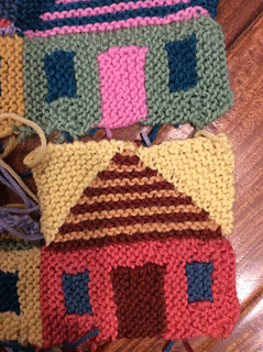Count long tail cast on row as row 1. Top house has 4 garter rows instead of 3 because I didn’t count cast on as row 1. Bottom house is correct