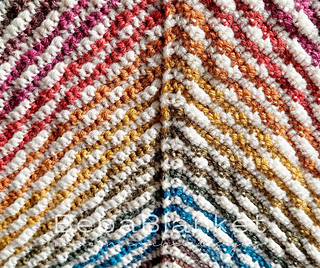 Back (wrong) side. The corner, where you carry the yarn