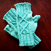 Mitts in size small, with the pattern on the back knit according to Chart A: Diamond 1, knit with Patons Baby Dreamtime Merino 4ply yarn.