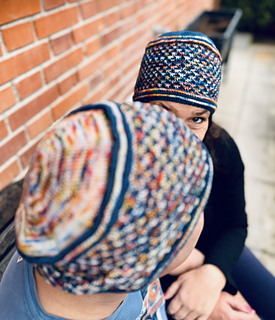 Her Cassaluna Hat follows the original pattern version.
He chose to reverse the main and contrast colors (MC & CC) for his sample.