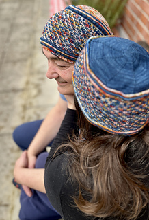 Her Cassaluna Hat follows the original pattern version.
He chose to reverse the main and contrast colors (MC & CC) for his sample.