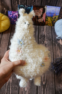 Big crochet soft toy - white plush alpaca with floral embroidery made of boucle yarn pdf pattern