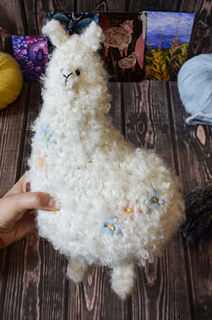 Big crochet soft toy - white plush alpaca with floral embroidery made of boucle yarn pdf pattern
