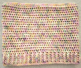 A picture of a the cat ear beanie layed flat to show construction