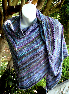 Larger version of Linen & Lace Shawl(ette) that uses a mixture of fingering and worsted weight yarns.  8.5 oz of 5  colors.  
65" wide x 30" deep.