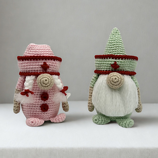 Pink Nurse Gnome with braids and buttons alongside Green Nurse Gnome with triangle hat and fluffy beard – crochet pattern PDF includes both styles.