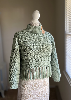 Pictured is Yarn Bee Dream Supreme in the color Tea.