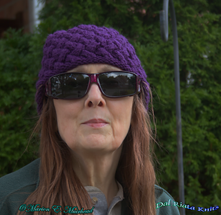 I wore this beanie on a slightly cool day at the end of August and it was very comfortable, even indoors.  Either wool or acrylic yarn will work well for this pattern.