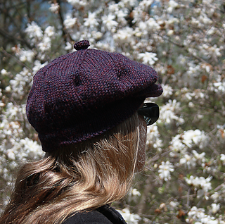 This peaked cap can be worn with ears covered or not.