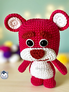 Handmade Lotso amigurumi inspired by Disney Pixar’s Toy Story, a perfect pink strawberry bear crochet pattern PDF for geek fans and plush collectors.