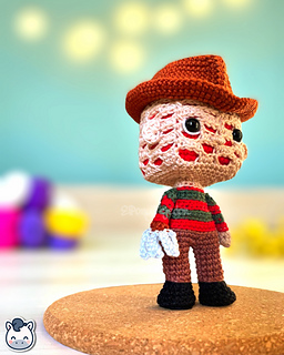 Handmade Freddy Krueger amigurumi inspired by Wes Craven’s A Nightmare on Elm Street, spooky Halloween crochet pattern PDF.