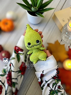 Handmade Oogie Boogie amigurumi inspired by Tim Burton’s The Nightmare Before Christmas, a perfect crochet pattern for Halloween fans and Disney lovers.
