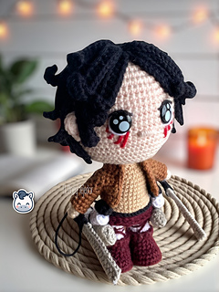 Handmade Eren Jaeger amigurumi inspired by Hajime Isayama’s Attack on Titan (Shingeki no Kyojin), a perfect crochet pattern for anime fans, otaku collections, and Funko-style plush lovers.