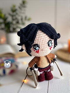 Handmade Eren Jaeger amigurumi inspired by Hajime Isayama’s Attack on Titan (Shingeki no Kyojin), a perfect crochet pattern for anime fans, otaku collections, and Funko-style plush lovers.