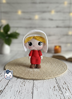 Handmade June Offred amigurumi inspired by Hulu’s The Handmaid’s Tale, a geeky and feminist crochet pattern PDF perfect for fans of dystopian stories, Margaret Atwood, and collectible plush dolls.