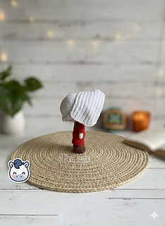 Handmade June Offred amigurumi inspired by Hulu’s The Handmaid’s Tale, a geeky and feminist crochet pattern PDF perfect for fans of dystopian stories, Margaret Atwood, and collectible plush dolls.