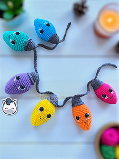 Handmade Christmas light string amigurumi inspired by cozy holiday decor, colorful kawaii Christmas crochet pattern PDF.