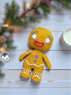 Amigurumi crochet free pattern of the Shrek Gingerbread Man with purple gumdrop buttons and white icing details.