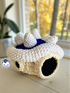 Crochet Amigurumi of the Blue Spiny Shell from Mario Kart made with soft blue and white yarn.
