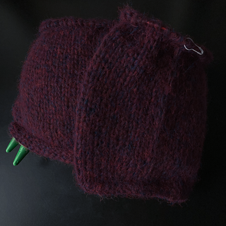 Length after two skeins is 8 inches: 3 inches from skein I also used to make the swatch, and 5 inches from full skein