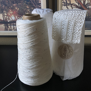 The yarn itself, plus a mini swatch I made the day it arrived because I couldn't wait to play with it.