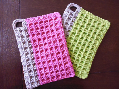 pair of waffled potholders with vertical bar