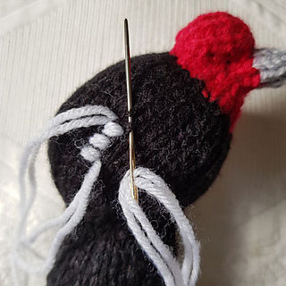 Sewing on Knitted Swan Facial Features
