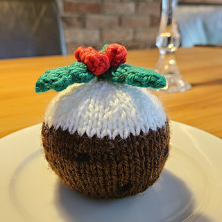 Round knitted Christmas pudding, can be used a a chocolate orange cover