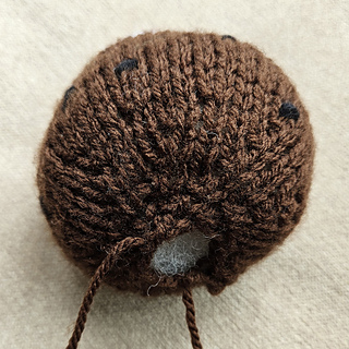 Round knitted Christmas pudding, leave a gap in the seam for a chocolate orange cover