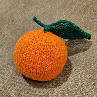 Knitted orange with leaf and stalk