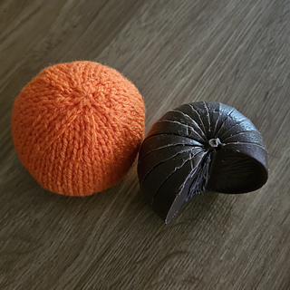 Knitted orange with half-eaten Terry's chocolate orange!
