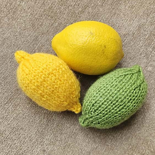 Knitted lemon and knitted lime with a real lemon