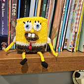 Knitted spongebob toy on a shelf