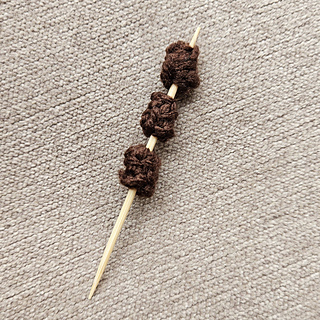 Knitted Raisins on Sticks for the Knitted Christingle
