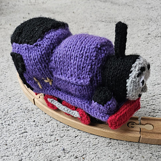 Charlie knitted toy train on a toy train track!
