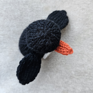 knitted penguin top view