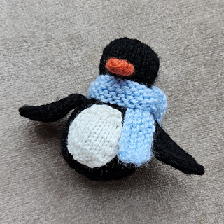 knitted penguin with scarf