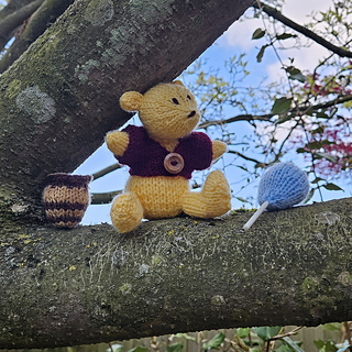 Knitted Classic Pooh with Honey Pot and Balloon in a Tree