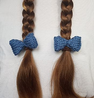 Knitted bows for hair on pigtails plaits