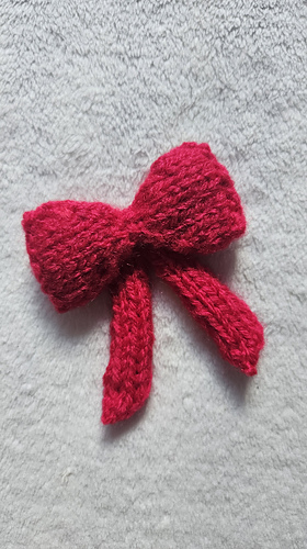 Plain knitted bow for any homemade Christmas Knitting project!