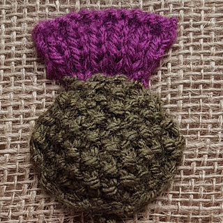Knitted thistle flower head