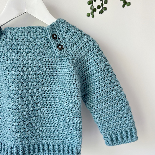 Ravelry Button Baby Sweater pattern by Hannah Cross