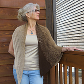 Wearing the shawl on the hypotenuse highlights both ends of the yarn skein. 